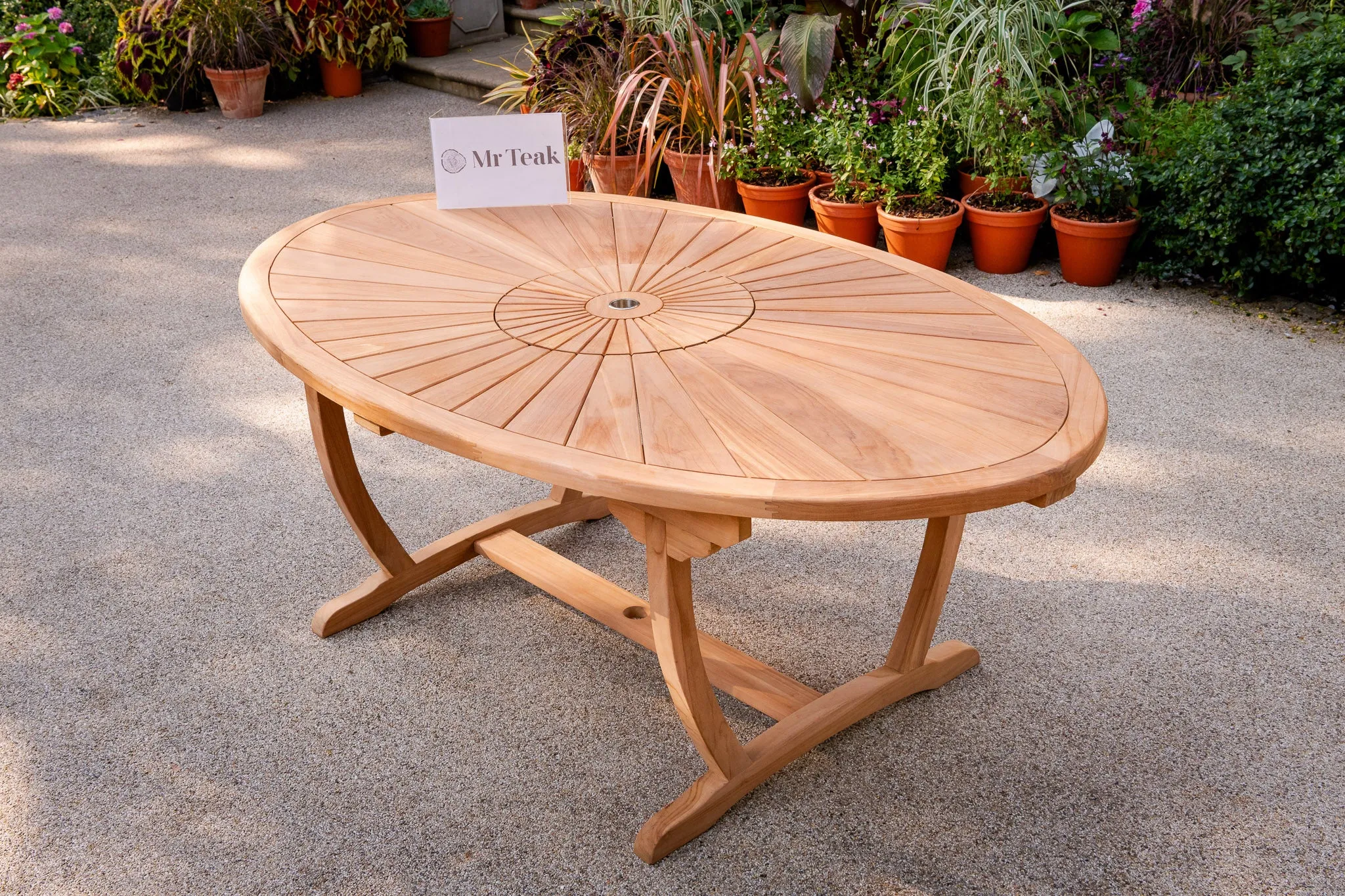 The Sherringham Sunburst Teak Oval Table